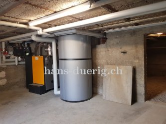 Heizzentrale mit Pelletskessel für Mehrfamilienhaus und Gewerbehaus